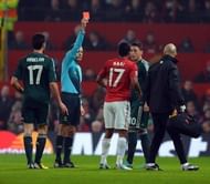 Turkish referee Cuneyt Cakir (2nd L) shows Manchester United's Nani the red card in Manchester on March 5, 2013